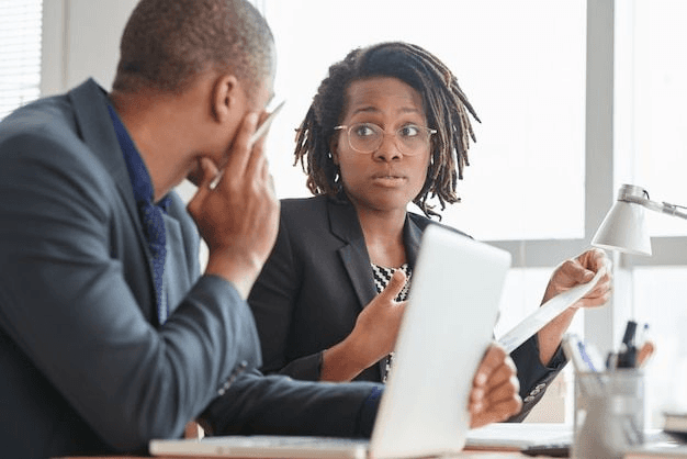 Consultant reviewing financial documents with a client